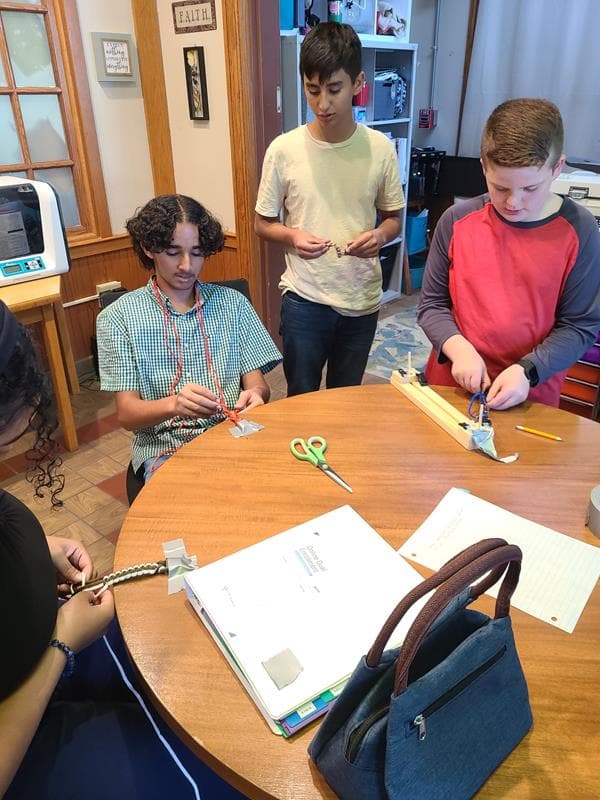 master academy high school students working